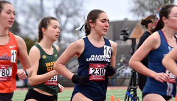 Josslyn Gaona running outdoor track in blue uis uniform