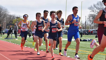 UIS Men's Track runners in blue uniforms running on track