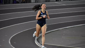 Maddie Miller-Ross running on an indoor track