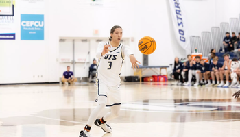 Adidas Davis playing basketball at UIS