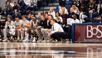 Men’s basketball bench and crowd