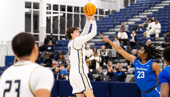 Isaiah Davis shooting a three-point shot