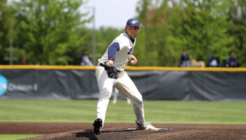 Graham Kasey pitching in white UIS uniform