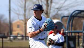 Jaden Mathon pitching in white UIS uniform