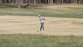 Brady Wilson golfing in fairway