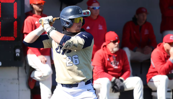 Johnny Wendling batting in gold UIS uniform
