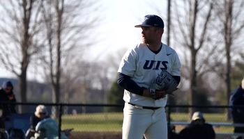 Quinn Hoftender pitching in white UIS uniform
