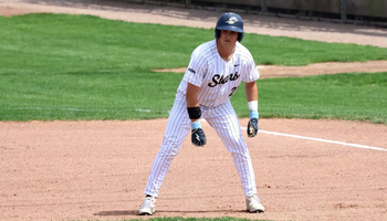 Corey Boyette base running in white UIS uniform