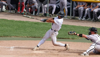 Noah Caceres batting in a UIS baseball game