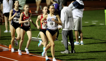 Maddie Miller running outdoor track in UIS uniform