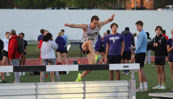 Ryan Jones jumping water barrier in steeplechase