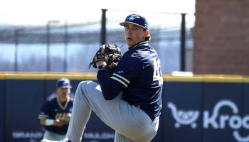 Jacob McPherson pitching in blue UIS baseball uniform