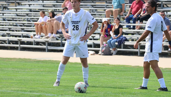 Joey Fitzgerald and Furkan Yalcin preparing to take a free kick 