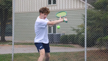 Kai Van-Roon playing tennis