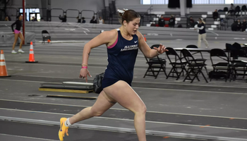 Kalli Drexler running track in blue UIS uniform