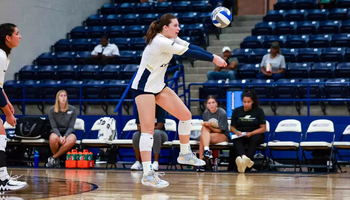 Makenna Cox passing a volleyball