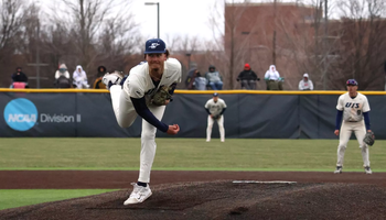 Richie Snider pitching in white UIS Baseball uniform