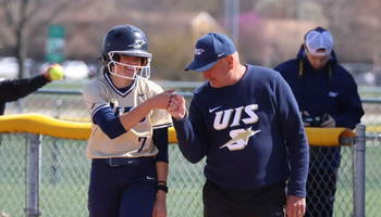 Rosie Bartletti and Coach Dan Frank on first base 