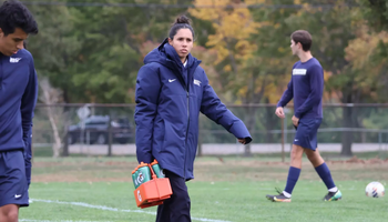 Samantha Fuentes, athletic trainer on field at UIS