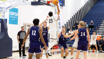 Tye Banks playing basketball at UIS