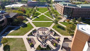 Aerial view of a campus courtyard with surrounding buildings.