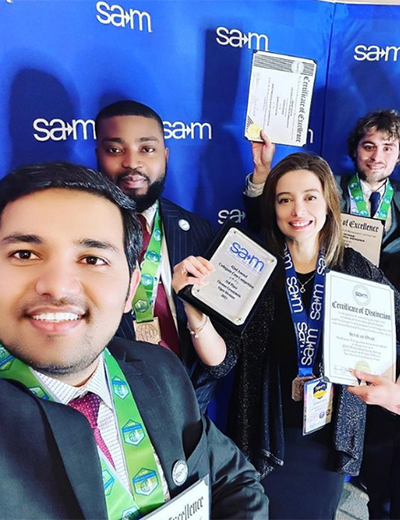 SAM students holding awards