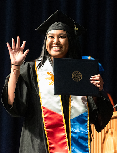 Graduate in cap and gown