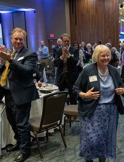 Mary Mitchell Beaumont walks to the stage to receive the 2025 William E. Winter Award.