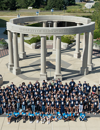 A mass group shot of the UIS Class of 2029 in front of the colonnade. 