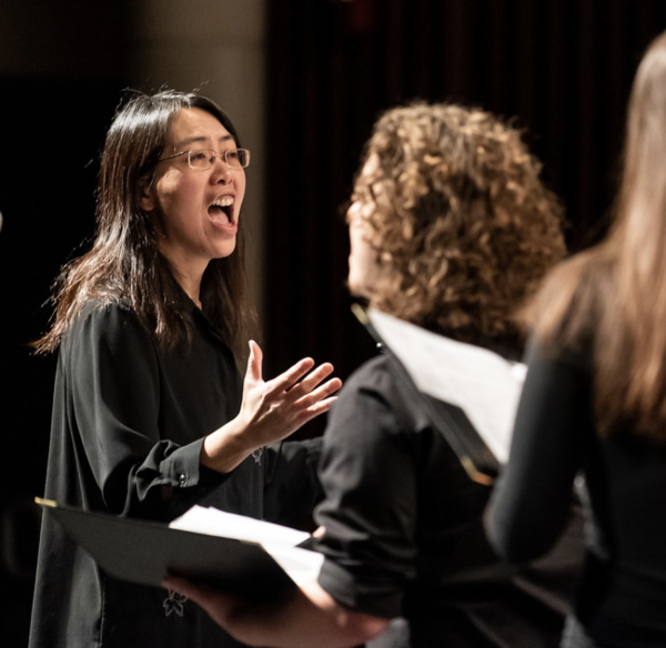 Woman Conducting a Chorus