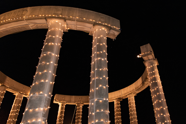 Colonnade decorated with holiday lights.