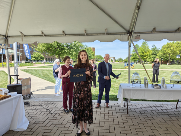 Gretchen Sitki receiving award