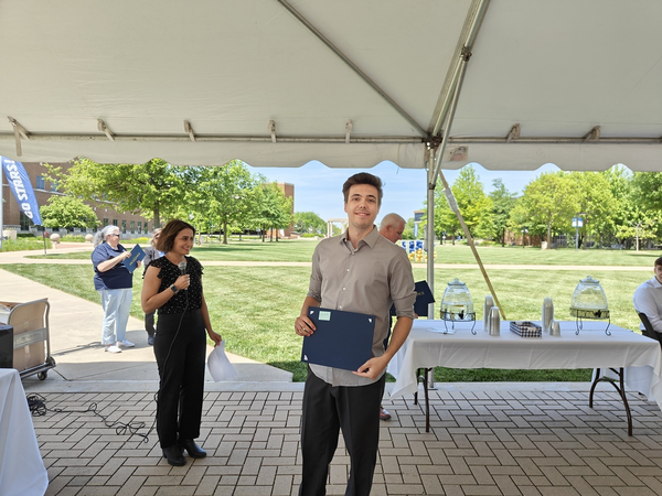 Joseph Brown receiving award
