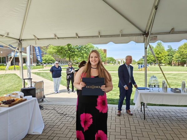 Mackenzie Bateman receiving award