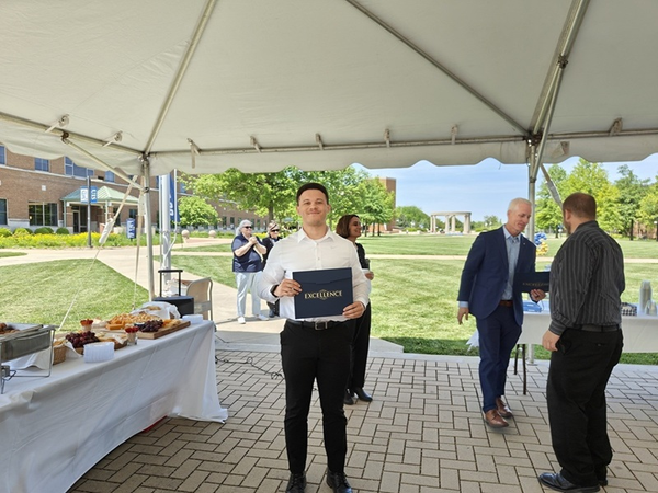 Kiev Glasscock receiving award