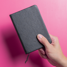 Person holding up journal