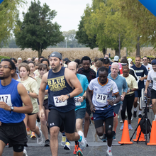 Running cross the start line at the 2024 Prairie Stars 5K