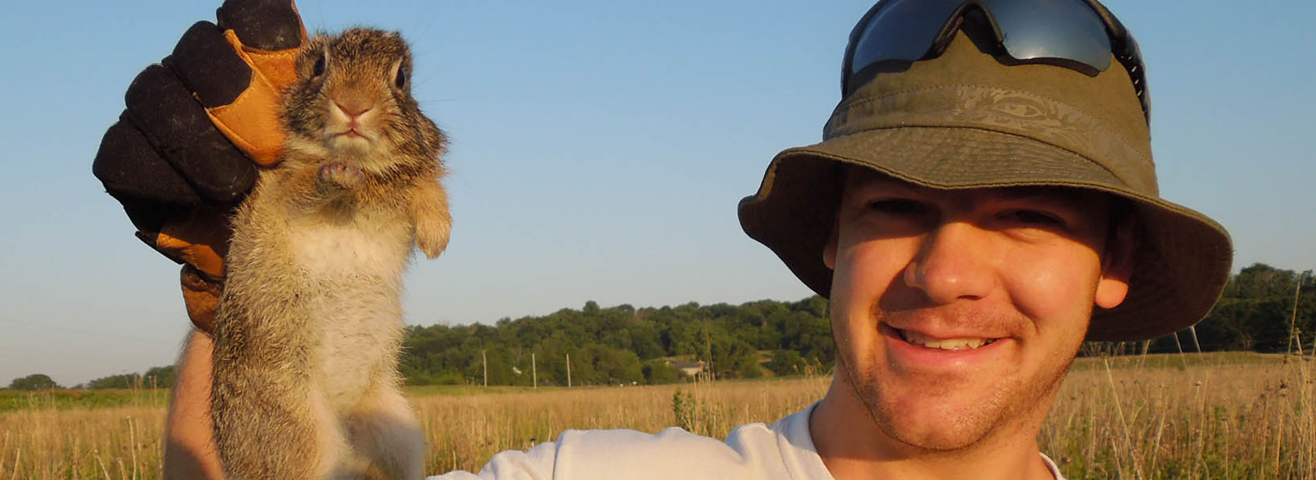 a man holding a small animal