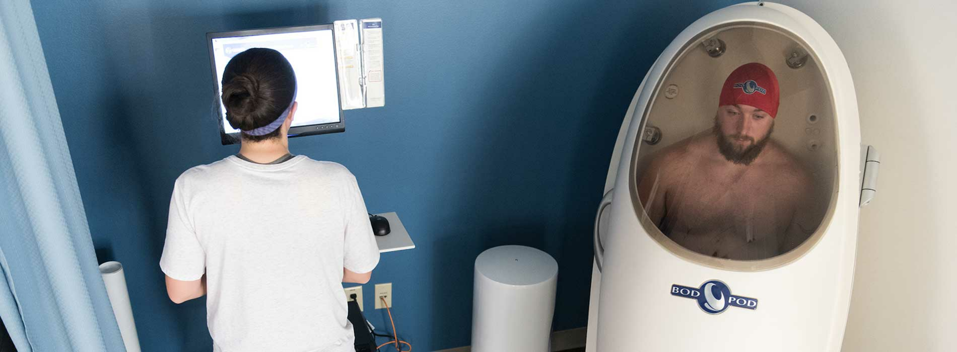 student in the bod pod