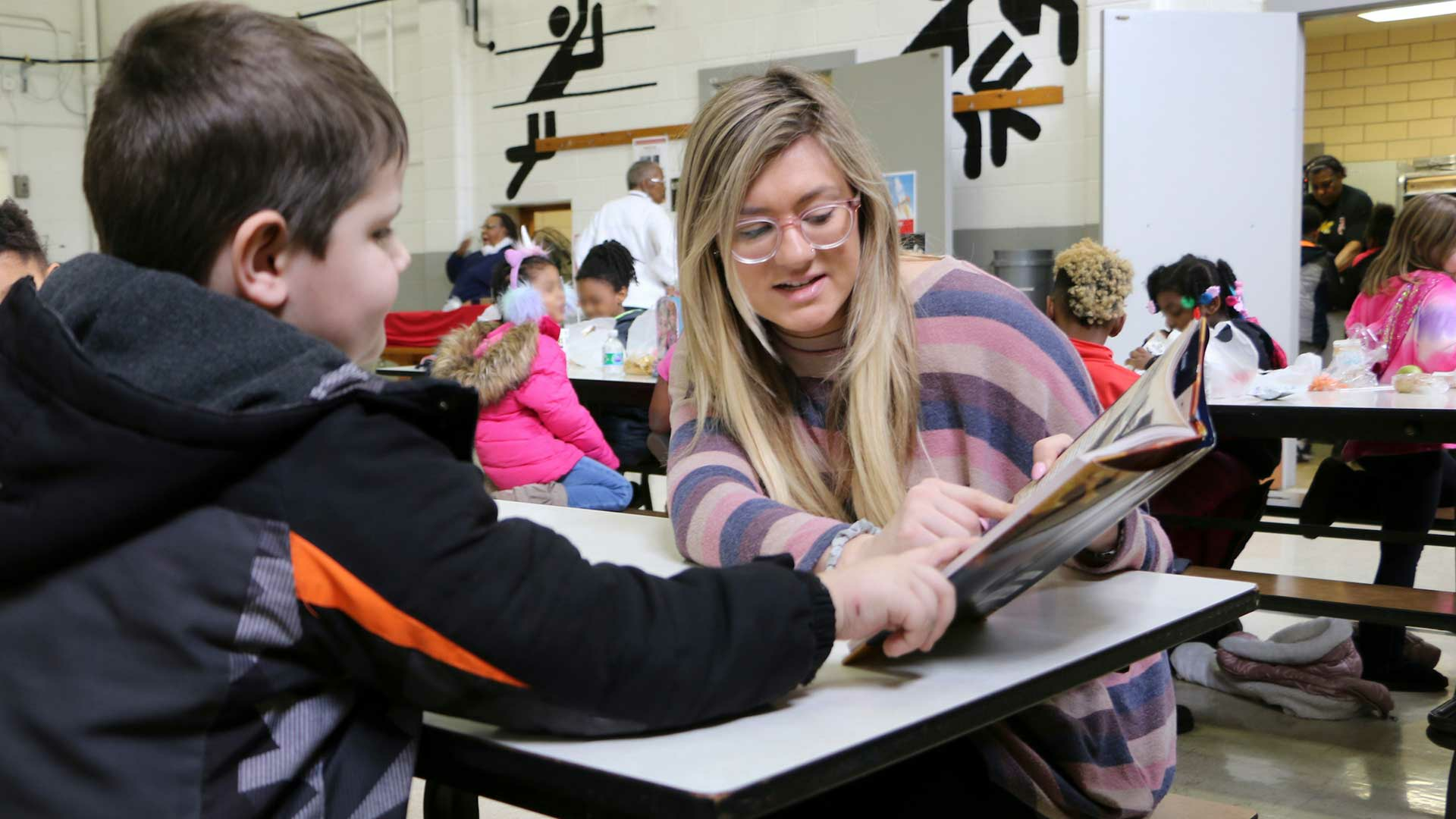 student working with child