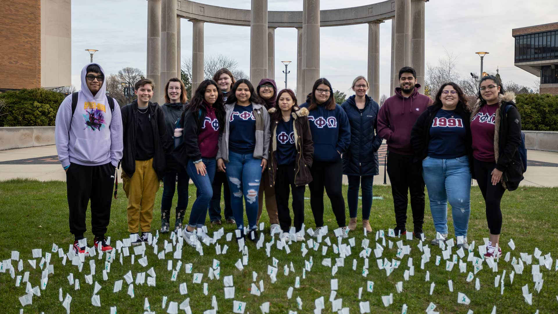 students in front of victim flags