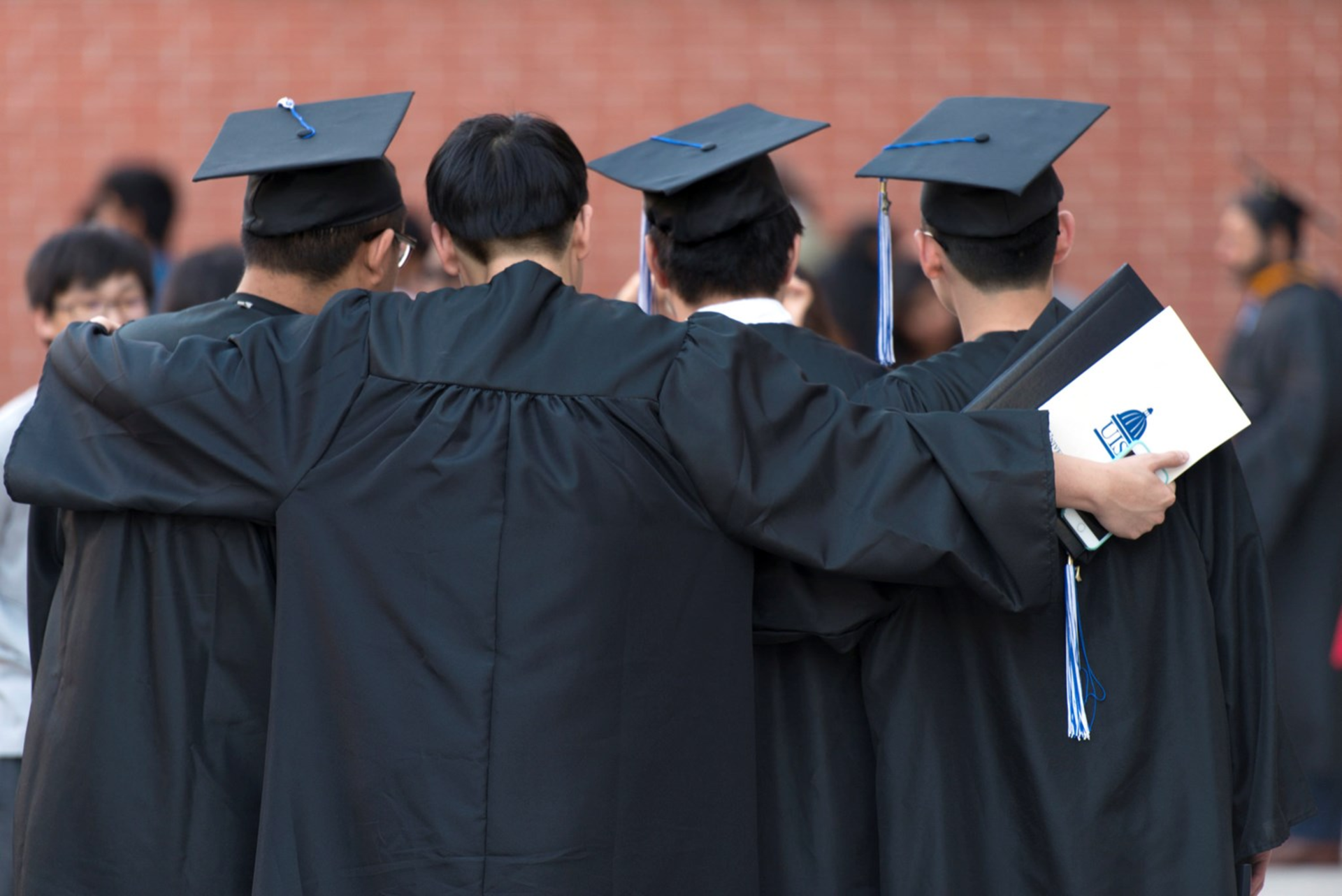 four international students graduation