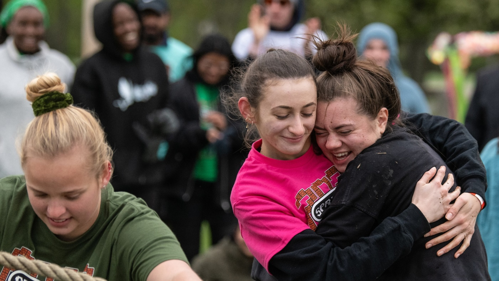 students hugging outside at a Springfest celebration