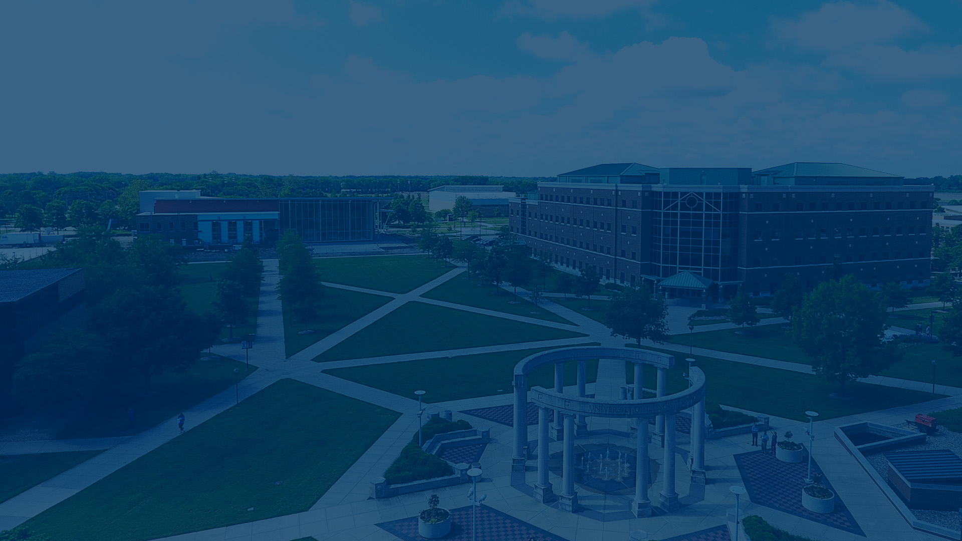 overhead view of colonnade, Student Union, and UHB with blue overlay