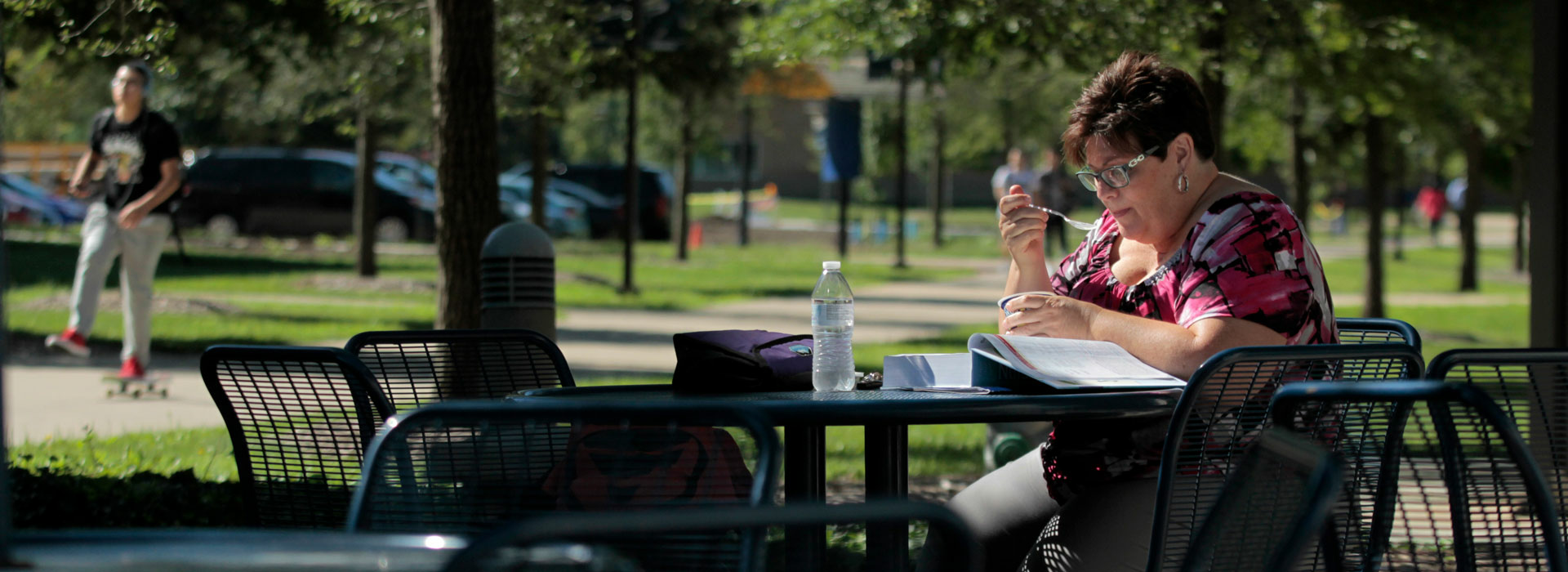 woman working at a table outside