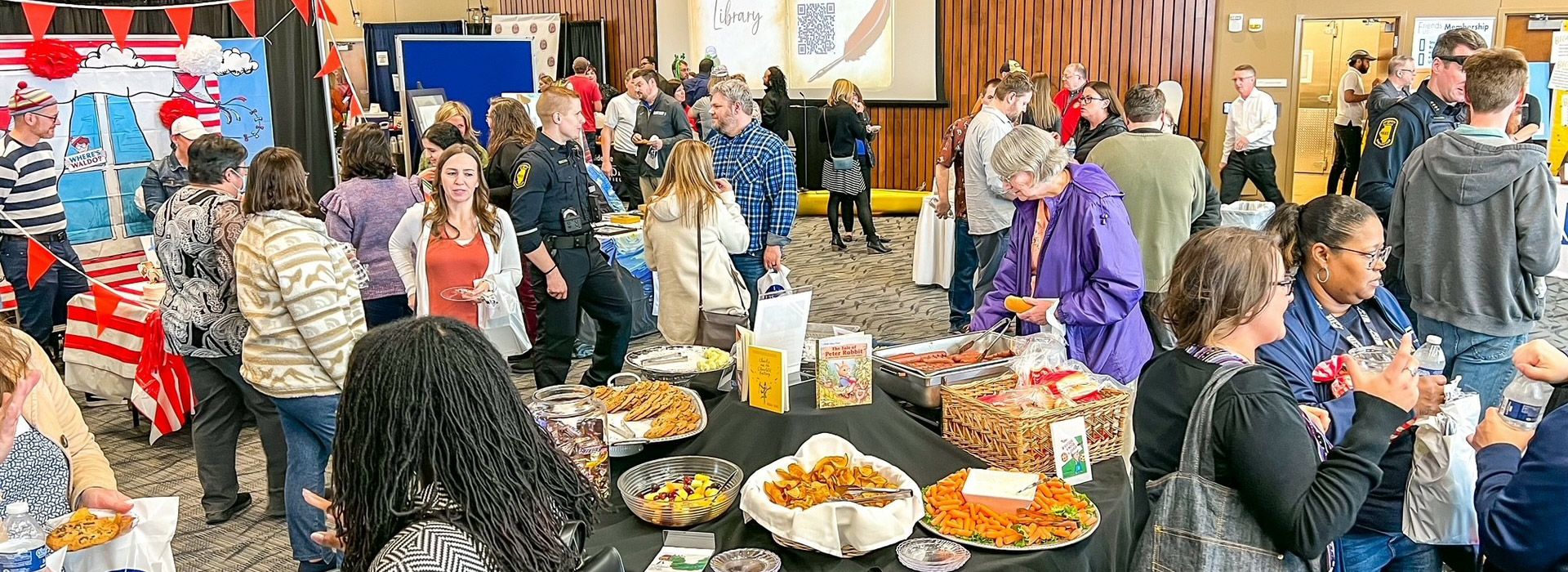 People socializing at Oh the Places You'll Go Campaign luncheon