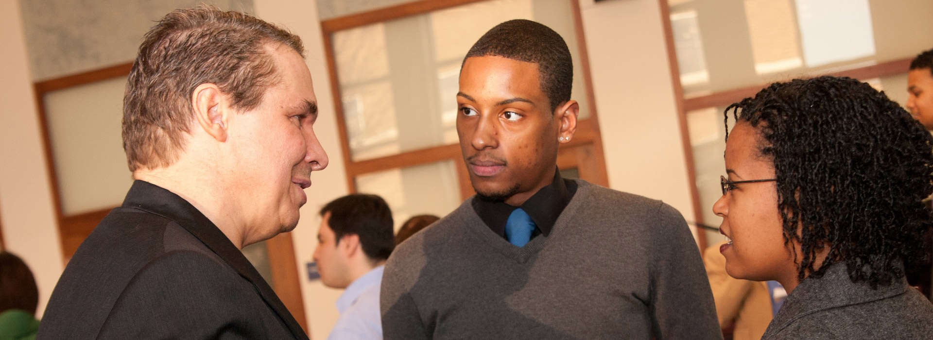 Author Greg Morensen talking with UIS students