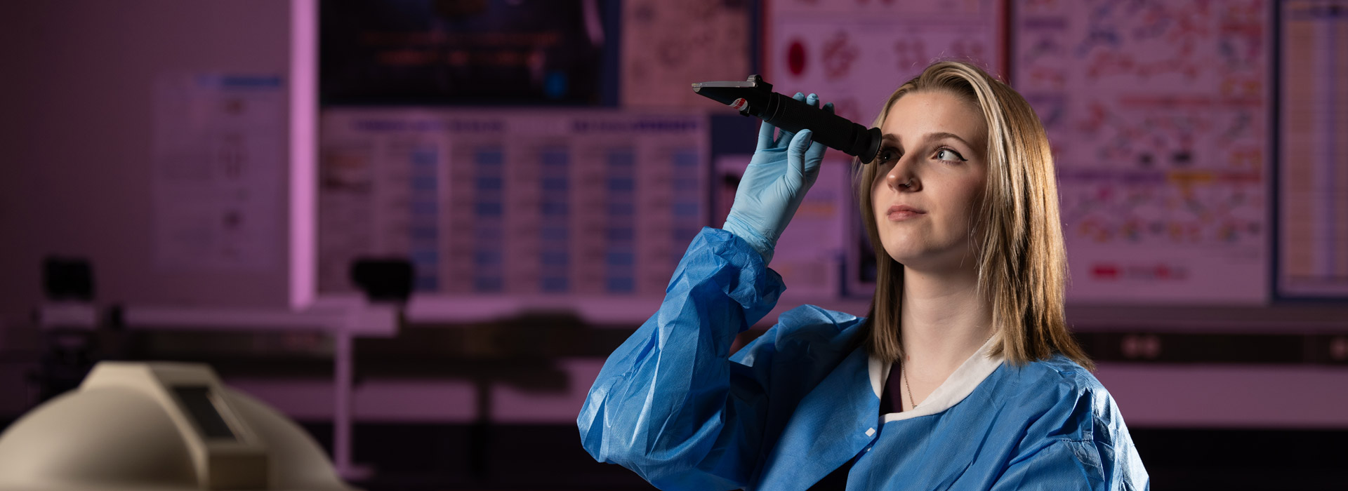 student performing microbiology testing