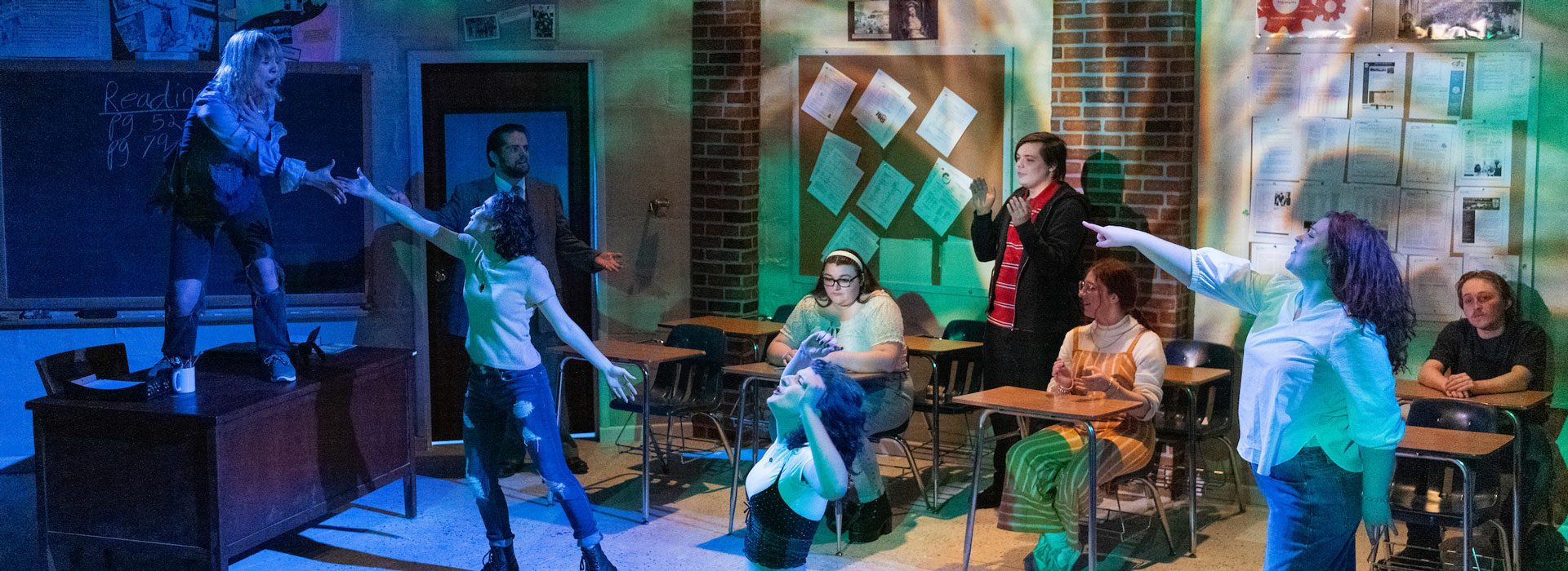 a group of stage performers performing in John Proctor