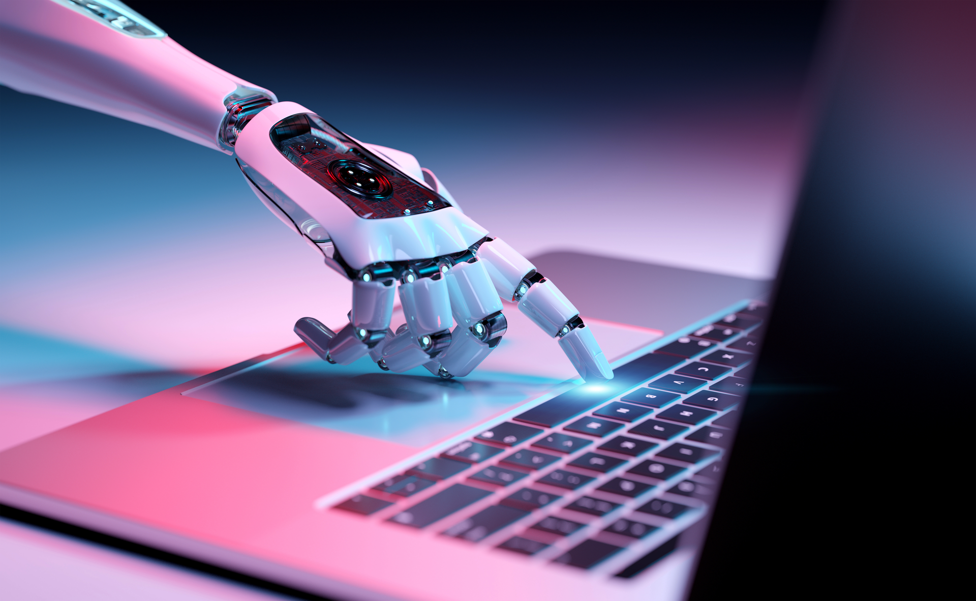 A robotic hand presses a laptop key, glowing in neon pink and blue, symbolizing AI and human-computer interaction